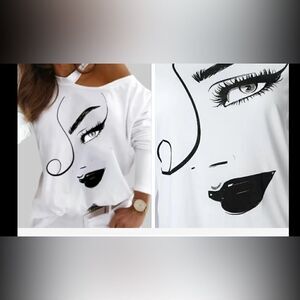 Cold shoulder, long sleeve polyester Top. With sexy eye smirk.